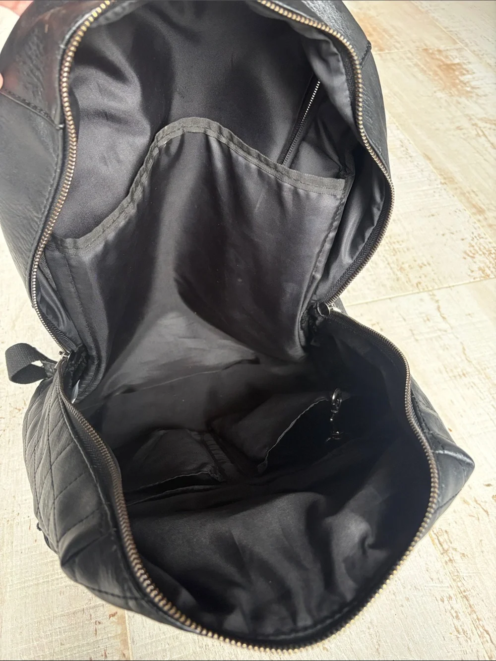 The Honest Company Diamond Quilted Black Faux Leather Backpack